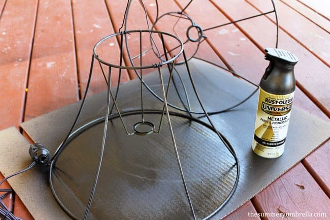 It's so easy to create this upcycled lamp shade pendant light! Come check it out now!